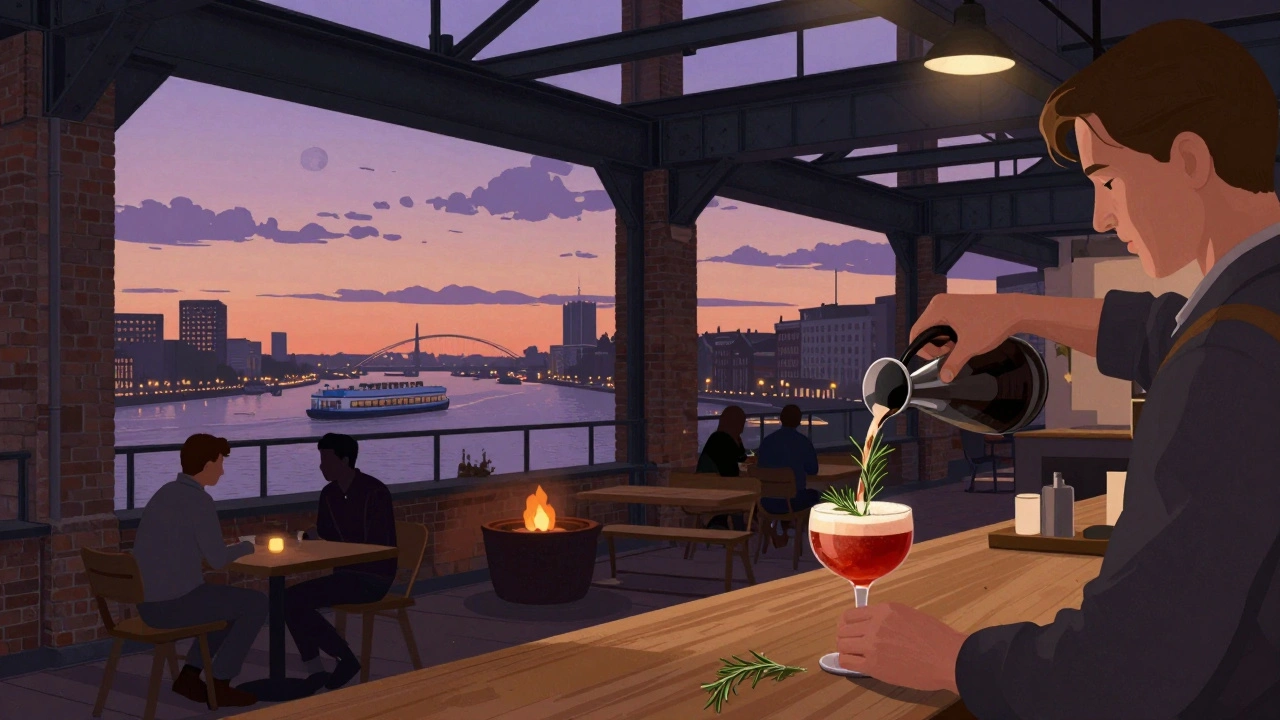 Industrial-chic De Hallen Rooftop with views of the IJ River and fire pits glowing at dusk.